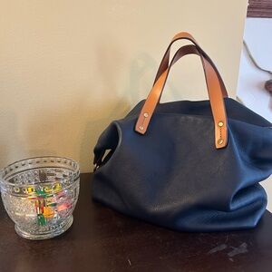 Navy Pebbled Leather Tote with Tan Top Handles. Includes crossbody strap